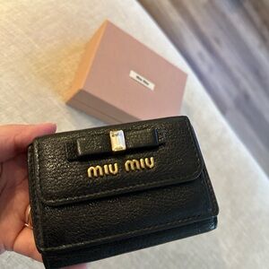 Miu Miu Bow Embellished Tri-fold Wallet In black